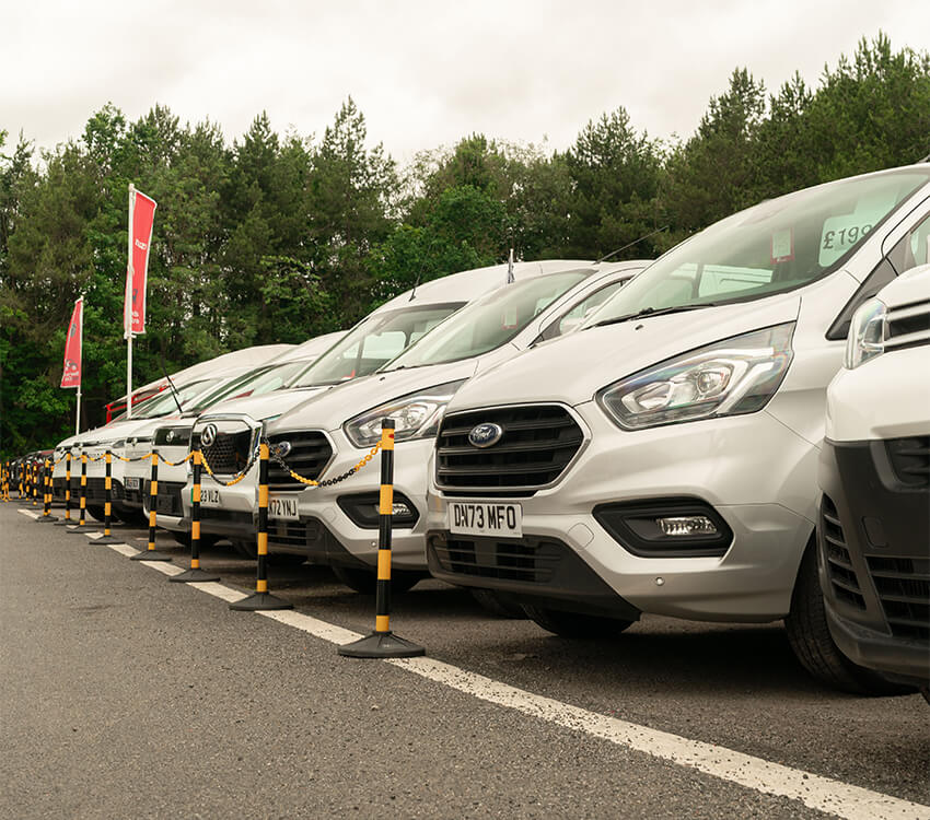 A group of marked vans